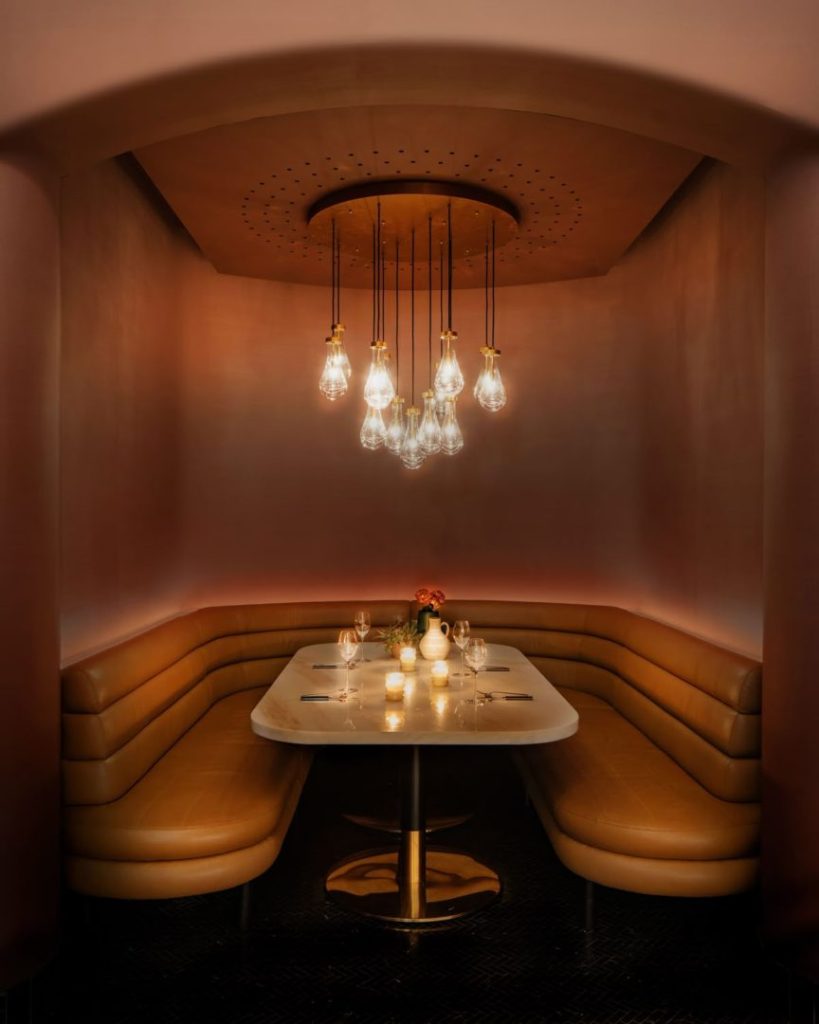 Lighting for a seating area with a sofa in a restaurant