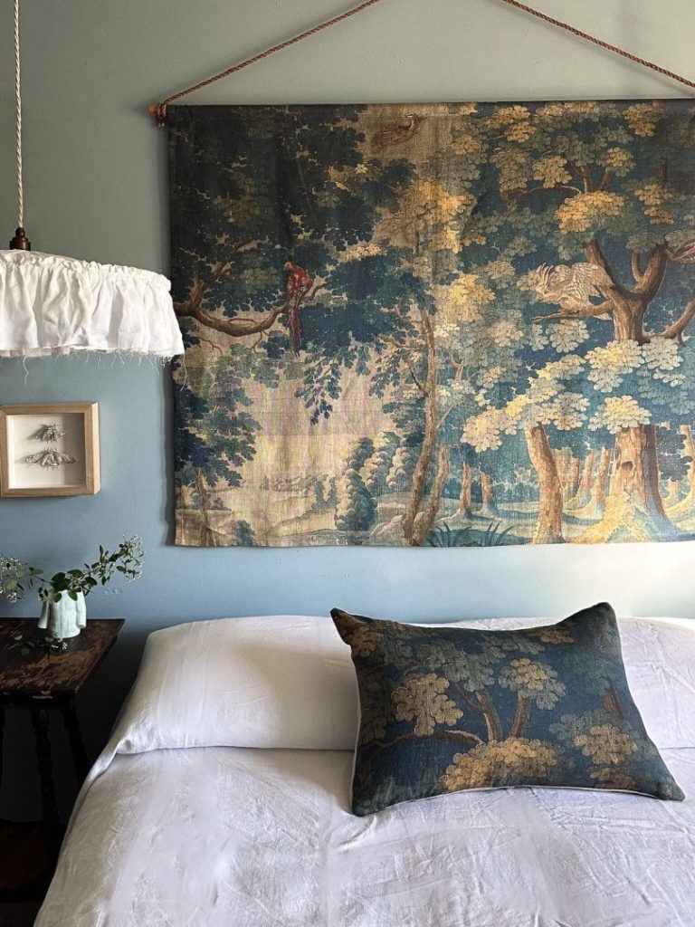 Blue tapestries and cushions in a bedroom